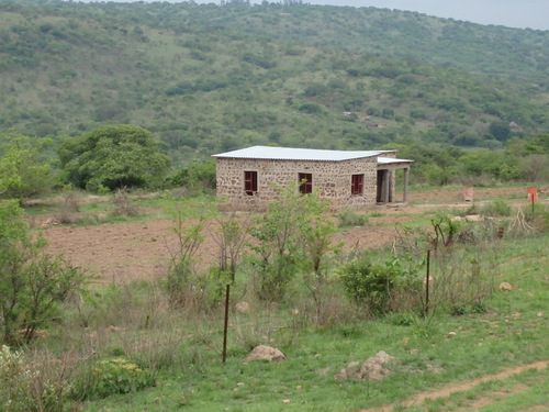 A nice stone masoned dwelling stands before us.